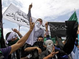 Manifestantes protestan contra Estados Unidos en la India. AP  /