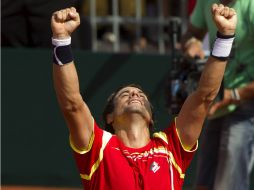 David Ferrer celebra su victoria sobre el estadounidense John Isner. ARCHIVO  /