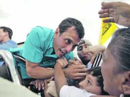 Capriles informó que hoy iniciará “una última vuelta por 20 estados” para cerrar la campaña “. XINHUA  /