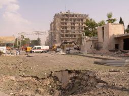 En la imagen, una de las calles del centro de Alepo tras la explosión de un coche bomba.AFP  /