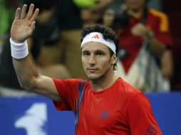 Juan Mónaco se impuso al búlgaro Grigor Dimitrov por 6-2 y 6-1. AP  /