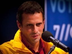 El líder opositor, Henrique Capriles, sostuvo una conversación con el presidente electo, Hugo Chávez. NTX  /