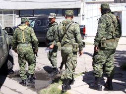 La zona permanece cercada por policías federales y elementos del Ejército. ARCHIVO  /