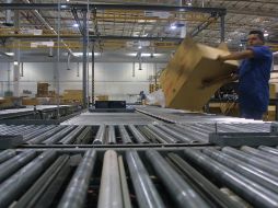 En el escenario internacional, es posible que la economía mundial avance a un ritmo lento e intermitente. ARCHIVO  /