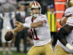 El quarterback de los gambusinos, Alex Smith, completó 18 de 19 pases para 232 yardas y tres anotaciones. AP  /