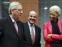 El presidente del Eurogrupo, Jean-Claude Juncker, el ministro español de Economía, Luis de Guindos, y la directora del FMI. EFE  /