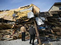 Muchos regresaron a los sótanos y casas que alquilaban, a pesar de que éstas siguen siendo inhabitables. REUTERS  /