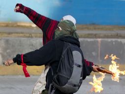 Les encontraron en posesión de bombas molotov y otros objetos. ARCHIVO  /