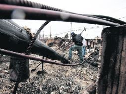 Reedificación. El desastre que ocasionó el metéoro dejó daños de infraestructura en Nueva York, Nueva Jersey y Conecticut. AFP  /