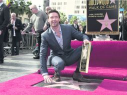 Jackman vivió un día inolvidable, no sólo recibió una estrella, también una nominación al Globo de Oro. AFP  /