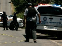 Elementos de varias corporaciones policiacas, incluyendo de la ZMG, acudieron en apoyo de sus homólogos. ARCHIVO  /