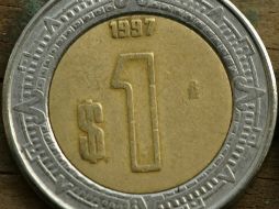 El precio final del banco central para el peso el jueves fue de 13.0227 unidades por dólar. ARCHIVO  /