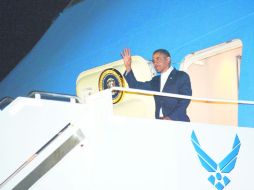 De vacaciones. Tras superar el abismo fiscal, Barack Obama regresó a Hawai para continuar su descanso de año nuevo. AFP  /