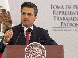 Peña Nieto durante la toma de posesión de los nuevos representantes de las juntas laborales de conciliación. EFE  /