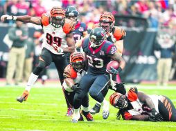Peligroso. Arian Foster recuperó su nivel en el partido donde Houston eliminó a los Bengalíes de Cincinnati. AP /