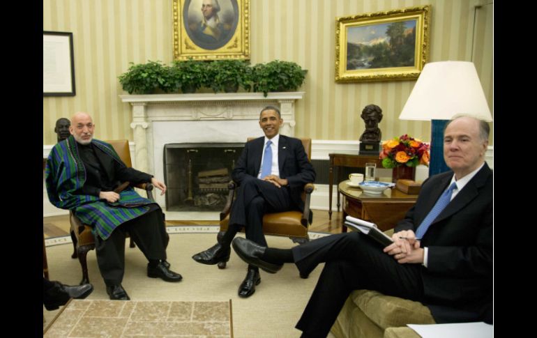 Los líderes durante la reunión privada en el resinto oficial de Obama. REUTERS /