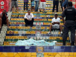 Junto al cadáver carbonizado había una lata de disolvente de pintura. AFP /