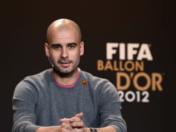 Guardiola estaría remplazando a Mancini en la dirección del equipo. AFP /