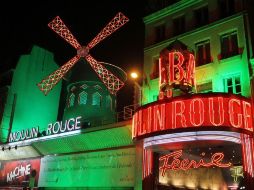 El Moulin Rouge está también ligado al nombre de Toulouse-Lautrec, quien pintó sus primeros carteles publicitarios. AFP /