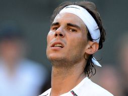 Nadal se recupera de una lesión de rodilla que lo alejó del tenis la mitad del año 2012. AFP /