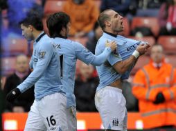 Jugadores del Manchester City celebran su triunfo sobre el Stoke. AP /