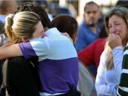 Parientes de los fallecidos en la discoteca brasileña Kiss. AP /