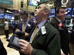 Nasdaq baja 0.64 puntos. AP /