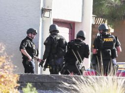 Vigilancia. Oficiales custodian el complejo de oficinas AP /