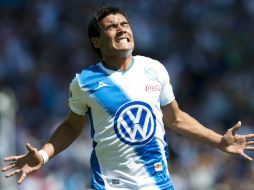 Alustiza celebra anotar el gol de la victoria poblana. MEXSPORT /