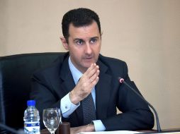 Bashar al Assad, presidiendo la ceremonia de posesión de sus nuevos ministros, en Damasco. EFE /