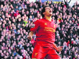 Estreno. El refuerzo brasileño Coutinho debutó como goleador de los Reds, al anotar el segundo tanto de ayer. ESPECIAL /