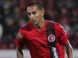 El zaguero de Xolos recibió una segunda amonestación en un mismo partido. MEXSPORT /