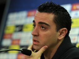 Xavi Hernández ha achacado parte de los problemas que sufrió anoche el Barça en Milán a las condiciones en que se encontraba el campo. AFP /