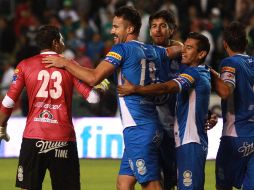 Los elementos de Puebla celebran la victoria sobre los Panzas verdes. MEXSPORT /