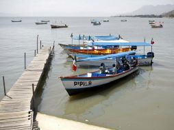 La Unidad Municipal y la UEPCBJ estuvieron a cargo de la búsqueda de los cuerpos en el lago. ARCHIVO /