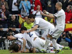 Los jugadores del Real pasan por una buena racha y esperan seguir así el martes ante el Manchester United. AP /