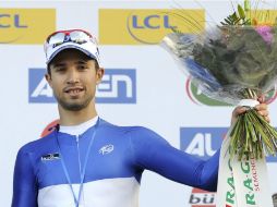 El ciclista francés Nacer Bouhanni del Francaise Des Jeux celebra en el podio su victoria en la primera etapa de la París Niza. EFE /