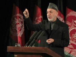 Karzai asevera que hay una alianza entre las tropas estadounidenses y talibanes. AFP /