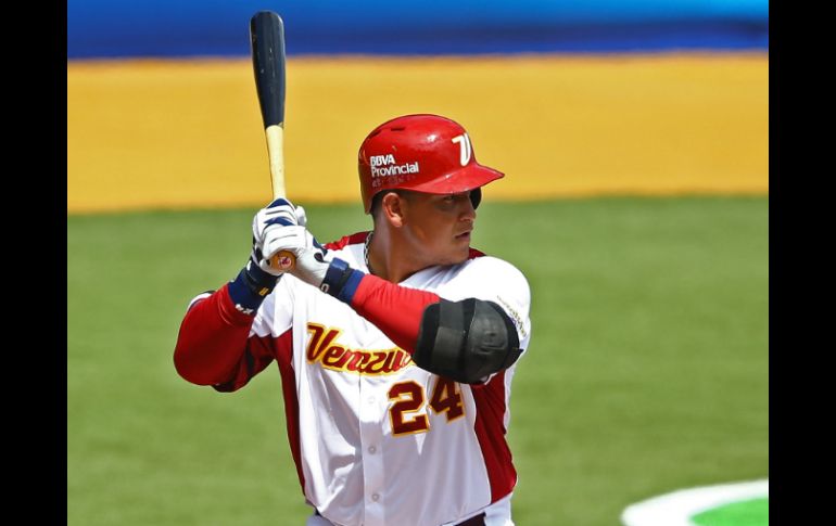 Tres carreras y un jonrón del ganador de la 'Triple Corona' despiden con triunfo a Venezuela. AFP /