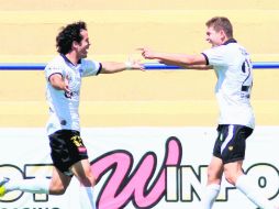 Los Melenudos, que festejan el triunfo, pueden confirmar su salvación el próximo viernes, cuando reciban a Lobos BUAP. ESPECIAL /