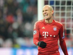 Robben hace una mueca al verse abajo en el marcador 2-0 ante el Arsenal, el cuadro alemán alcanza a calificar por los goles de visita. EFE /