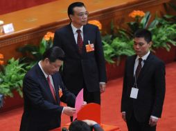Xi Jinping, al momento de emitir su voto. AFP /