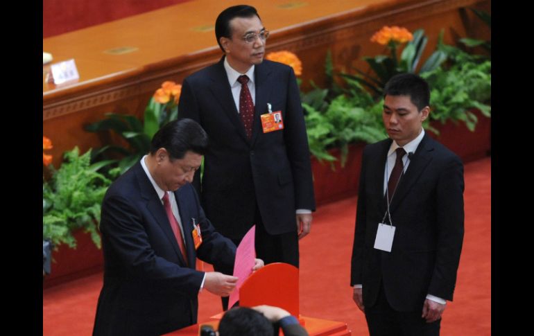 Xi Jinping, al momento de emitir su voto. AFP /