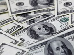 En casas de cambio de Tijuana la divisa se compra en un precio máximo de 12.00 pesos y se vende en 12.66 pesos. ARCHIVO /