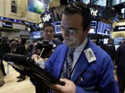 El indicador Nasdaq asciende 0.7%. AP /