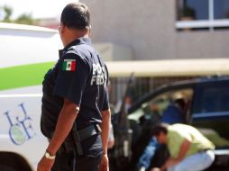 Los peritos del Instituto Jalisciense de Ciencias Forenses (IJCF) acuden a realizan las investigaciones correspondientes.  /