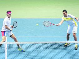 La pareja serbia, Nenad Zimonjic y Ilija Bozoljac, vencieron al dúo número uno mundial, los estadounidenses Mike y Bob Bryan. AFP /