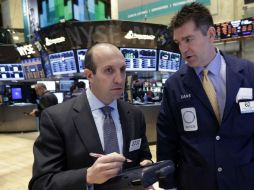 Las minutas del Comité de Mercado Abierto de la Fed muestran que sus integrantes están a favor de aminorar su impulso económico. AP /