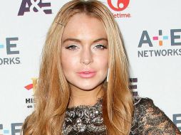 Lohan comparte créditos con Charlie Sheen en la nueva película ''Scary Movie 5''. . ARCHIVO /