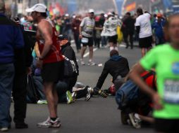 Aspecto de las labores de auxilio en el área de las explosiones. AP /